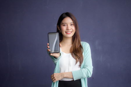 thai china adult office girl white shirt show her smart phoneの写真素材