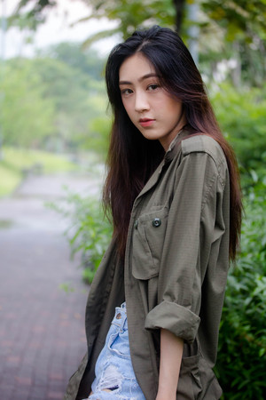 Portrait of thai adult beautiful girl relax and smileの写真素材