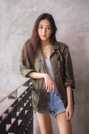 Portrait of thai adult beautiful girl relax and smile