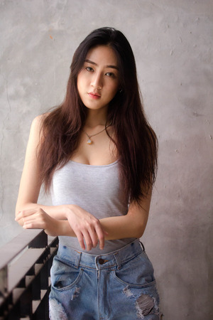 Portrait of thai adult beautiful girl relax and smileの写真素材