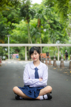 Portrait of thai high school student uniform teen beautiful girl happy and relaxの写真素材