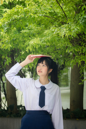 asia thai high school student uniform beautiful girl read a bookの写真素材