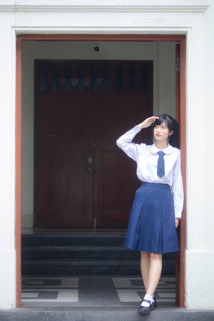 Portrait of thai high school student uniform teen beautiful girl happy and relaxの写真素材