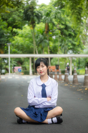 Portrait of thai high school student uniform teen beautiful girl happy and relaxの写真素材