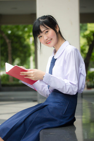 asia thai high school student uniform beautiful girl read a bookの写真素材