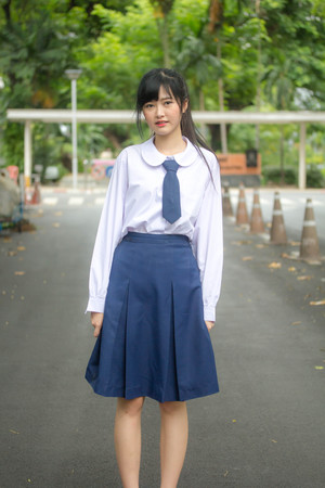 Portrait of thai high school student uniform teen beautiful girl happy and relaxの写真素材