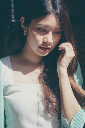 thai china adult office girl white shirt relax and smileの写真素材