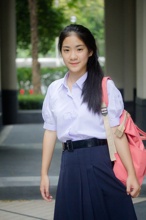 Portrait of thai high school student uniform teen beautiful girl happy and relaxの写真素材