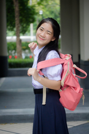 Portrait of thai high school student uniform teen beautiful girl happy and relaxの写真素材
