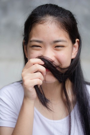 asia thai teen White t-shirt beautiful girl happy and relaxの写真素材