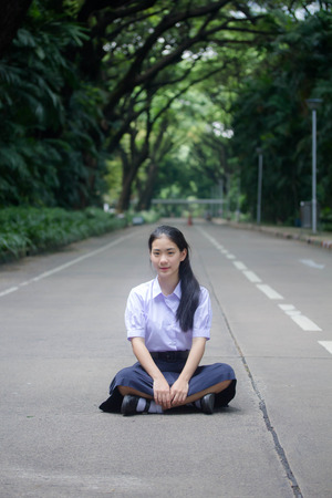 Portrait of thai high school student uniform teen beautiful girl happy and relaxの写真素材
