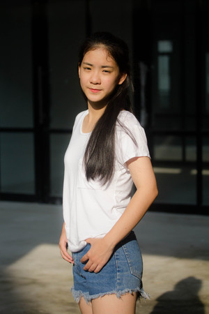 asia thai teen White t-shirt beautiful girl happy and relaxの写真素材