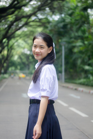 Portrait of thai high school student uniform teen beautiful girl happy and relaxの写真素材