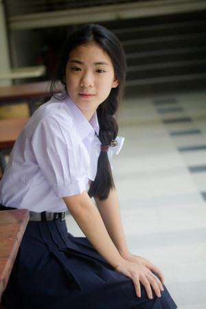 Portrait of thai high school student uniform teen beautiful girl happy and relaxの写真素材
