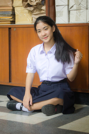 Portrait of thai high school student uniform teen beautiful girl happy and relaxの写真素材