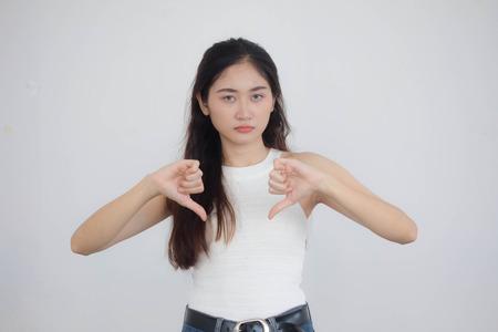 Portrait of thai china adult beautiful girl White shirt blue jeans do not like