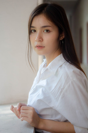 thai china adult office girl white shirt relax and smileの写真素材