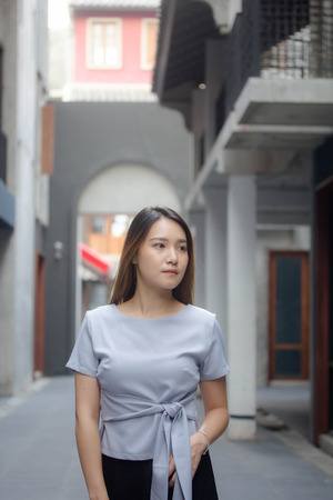 portrait of thai china adult office girl relax and smileの写真素材