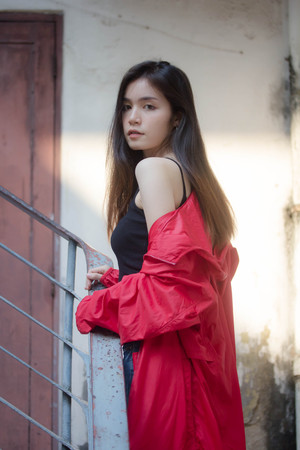 asia thai teen red coat on street fashionの写真素材