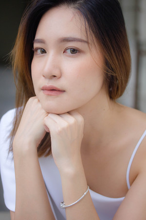 portrait of thai china adult office girl white shirt relax and smileの写真素材