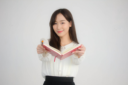 portrait of thai china adult office girl white shirt reading red book