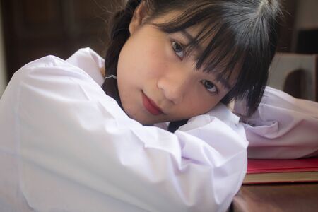 Portrait of thai high school student uniform teen beautiful girl happy and relaxの写真素材