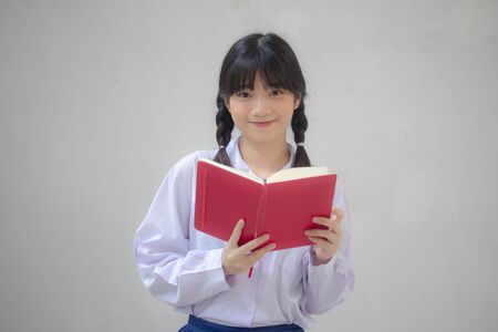 asia thai high school student uniform beautiful girl read a bookの写真素材