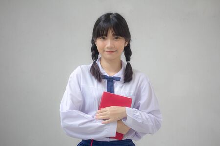 Portrait of thai high school student uniform teen beautiful girl happy and relaxの写真素材