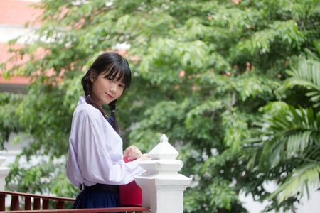 thai high school student uniform teen beautiful girl happy and relaxの写真素材