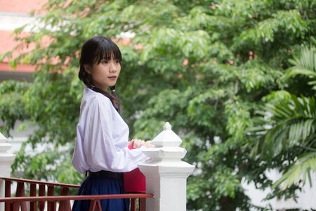 thai high school student uniform teen beautiful girl happy and relaxの写真素材