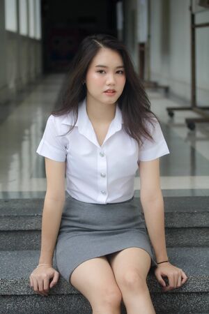 thai china adult office girl white shirt relax and smileの写真素材