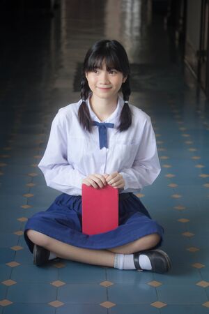 Portrait of thai high school student uniform teen beautiful girl happy and relaxの写真素材