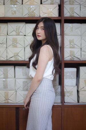 portrait of thai china adult office girl white shirt relax and smile