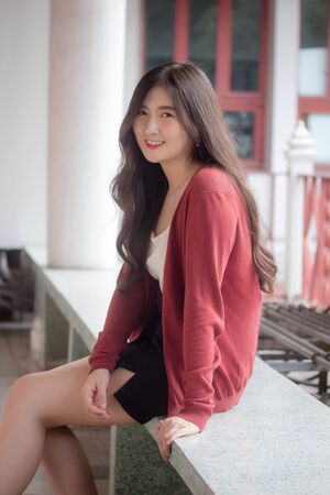 Portrait of thai adult working women white shirt relax and smileの写真素材