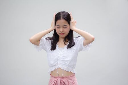 asia thai teen White t-shirt beautiful girl not listenの写真素材