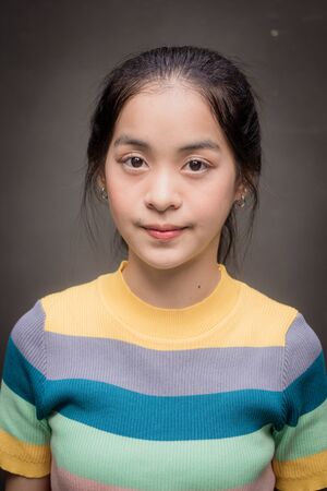 asia thai teen color t-shirt beautiful girl smile and relaxの写真素材