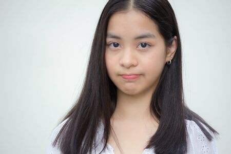 asia thai teen White t-shirt beautiful girl smile and relaxの写真素材