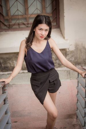 Portrait of thai adult beautiful girl relax and smileの写真素材