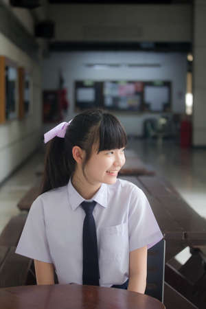 Portrait of thai Junior high school student uniform teen beautiful girl happy and relaxの写真素材