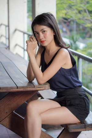 Portrait of thai adult beautiful girl relax and smileの写真素材