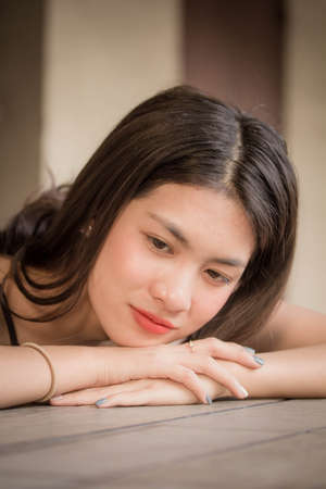 Portrait of thai adult beautiful girl relax and smile