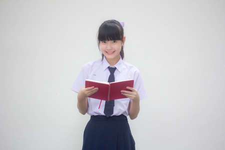 asia thai Junior high school student uniform beautiful girl read a bookの写真素材