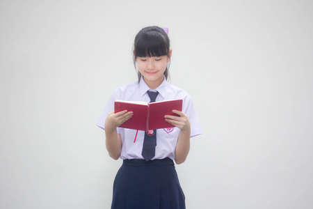 asia thai Junior high school student uniform beautiful girl read a bookの写真素材