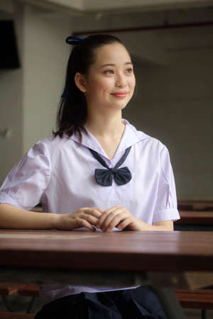 asia thai Junior high school student uniform beautiful girl smile and relaxの写真素材