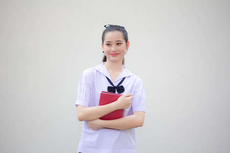 asia thai Junior high school student uniform beautiful girl smile and relaxの写真素材