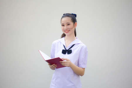 asia thai Junior high school student uniform beautiful girl read a bookの写真素材