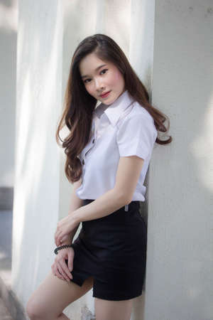 thai adult student university uniform beautiful girl smile and relaxの写真素材