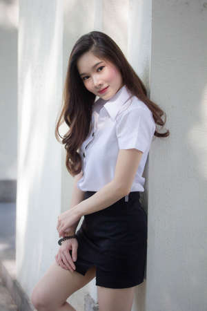 thai adult student university uniform beautiful girl smile and relaxの写真素材