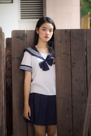 japanese teen beautiful girl in student uniform happy and relaxの写真素材