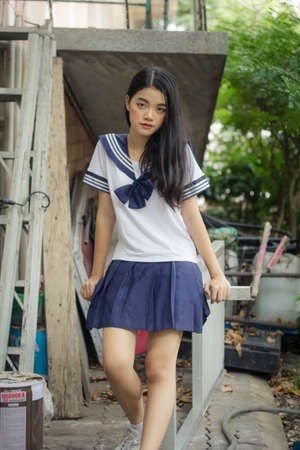 japanese teen beautiful girl in student uniform happy and relaxの写真素材